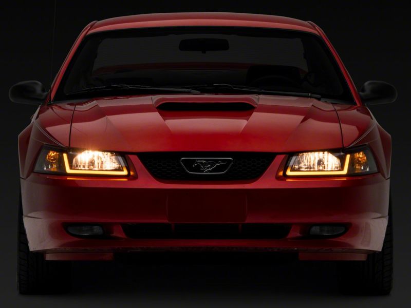 Raxiom Raxiom 99-04 Ford Mustang Axial Series Headlights w/ Sequential LED Bar- Black Housing (Clear Lens)
