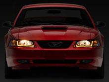 Load image into Gallery viewer, Raxiom Raxiom 99-04 Ford Mustang Axial Series Headlights w/ Sequential LED Bar- Black Housing (Clear Lens)