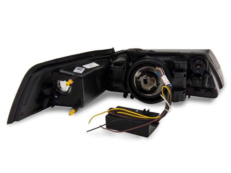 Raxiom Raxiom 99-04 Ford Mustang Axial Series Headlights w/ Sequential LED Bar- Black Housing (Clear Lens)