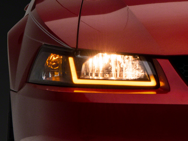 Raxiom Raxiom 99-04 Ford Mustang Axial Series Headlights w/ Sequential LED Bar- Black Housing (Clear Lens)