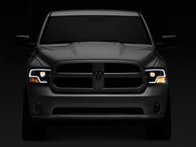 Load image into Gallery viewer, Raxiom 09-18 RAM 1500 LED Halo Projector Headlights- Black Housing (Clear Lens) - Raxiom R111516