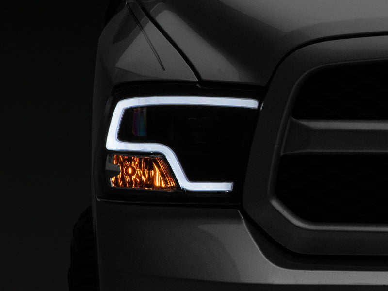 Raxiom 09-18 RAM 1500 LED Halo Projector Headlights- Black Housing (Clear Lens) - Raxiom R111516
