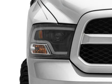 Load image into Gallery viewer, Raxiom 09-18 RAM 1500 LED Halo Projector Headlights- Black Housing (Clear Lens) - Raxiom R111516