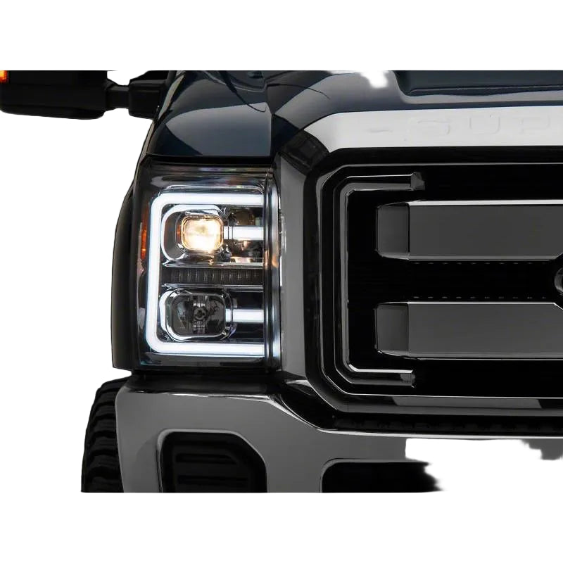 Close-up of a Ford Super Duty front corner with the Raxiom LED projector and accent bar illuminated