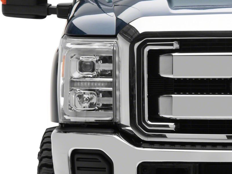 Close-up of the front corner of a Ford Super Duty showing the Raxiom headlight and its LED accent bar unlit
