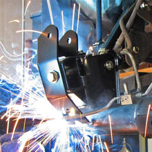 Load image into Gallery viewer, RockJock axle bracket being welded onto a Jeep TJ/LJ rear axle housing during installation