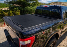 Load image into Gallery viewer, Roll-N-Lock 15-18 Chevy Silverado/Sierra 2500/3500 SB 77-3/8in M-Series Retractable Tonneau Cover - Black Ops Auto Works