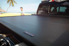 Load image into Gallery viewer, Roll-N-Lock 17-19 Ford F-250/F-350 Super Duty 80-3/8in E-Series Retractable Tonneau Cover - Black Ops Auto Works