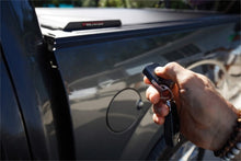 Load image into Gallery viewer, Roll-N-Lock 17-19 Ford F-250/F-350 Super Duty 80-3/8in E-Series Retractable Tonneau Cover - Black Ops Auto Works
