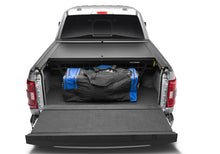 Load image into Gallery viewer, Roll-N-Lock 17-19 Ford F-250/F-350 Super Duty SB 80-3/8in Cargo Manager - Black Ops Auto Works