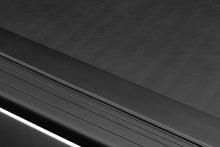 Load image into Gallery viewer, Roll-N-Lock 2019 RAM 1500 65-1/2in M-Series Retractable Tonneau Cover - Black Ops Auto Works