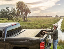 Load image into Gallery viewer, Roll-N-Lock 2020 Chevy Silverado / GMC Sierra 2500-3500 80-1/2in M-Series Retractable Tonneau Cover - Black Ops Auto Works