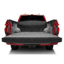 Load image into Gallery viewer, Roll-N-Lock 2021 Ford F-150 67.1in A-Series Retractable Tonneau Cover open bed view