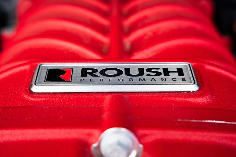 Roush 422349 705HP Red Edition supercharger kit for 2021-2026 F-150, tight straight-on Roush Performance badge closeup