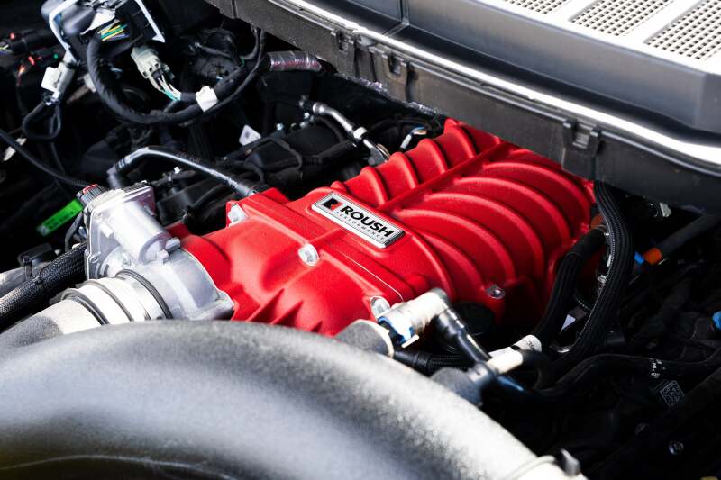Roush 422349 705HP Red Edition supercharger kit for 2021-2026 F-150, installed view beneath the cowl