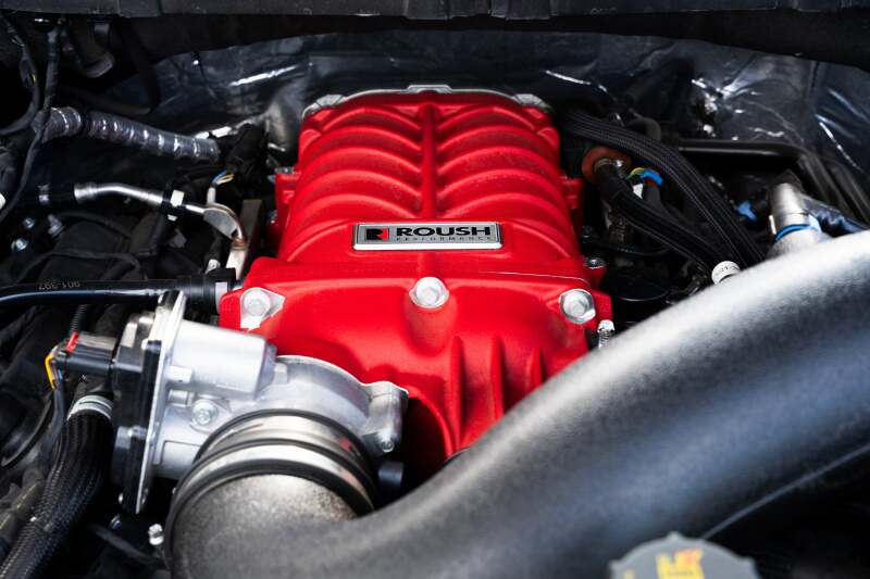 Roush 422349 705HP Red Edition supercharger kit for 2021-2026 F-150, installed front detail with intake plumbing