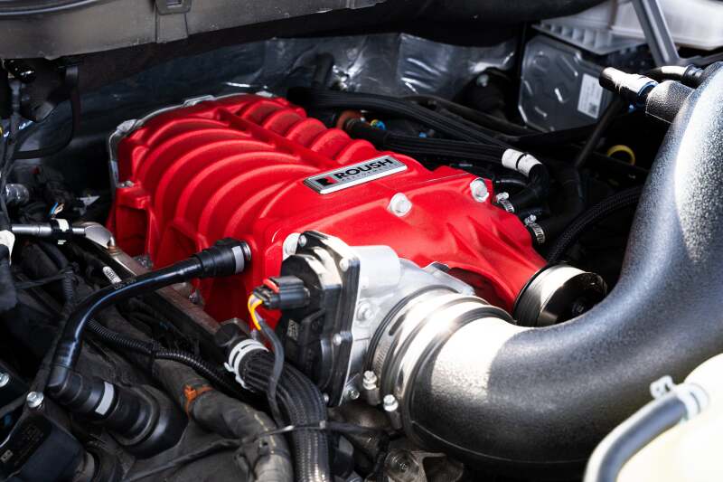 Roush 422349 705HP Red Edition supercharger kit for 2021-2026 F-150, installed side detail with intake tube