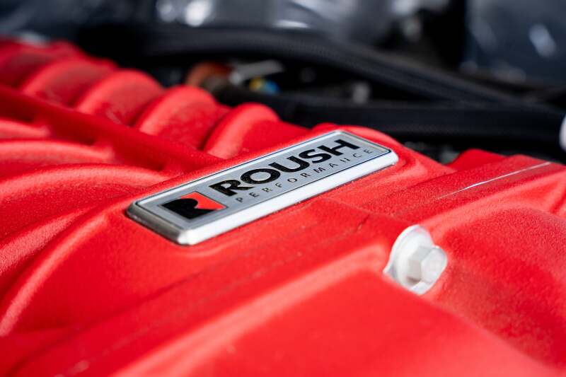 Roush 422349 705HP Red Edition supercharger kit for 2021-2026 F-150, angled macro of the Roush Performance badge