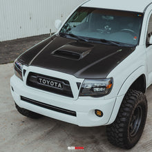 Load image into Gallery viewer, Seibon Seibon 05-11 Toyota Tacoma TR-Style Carbon Fiber Hood