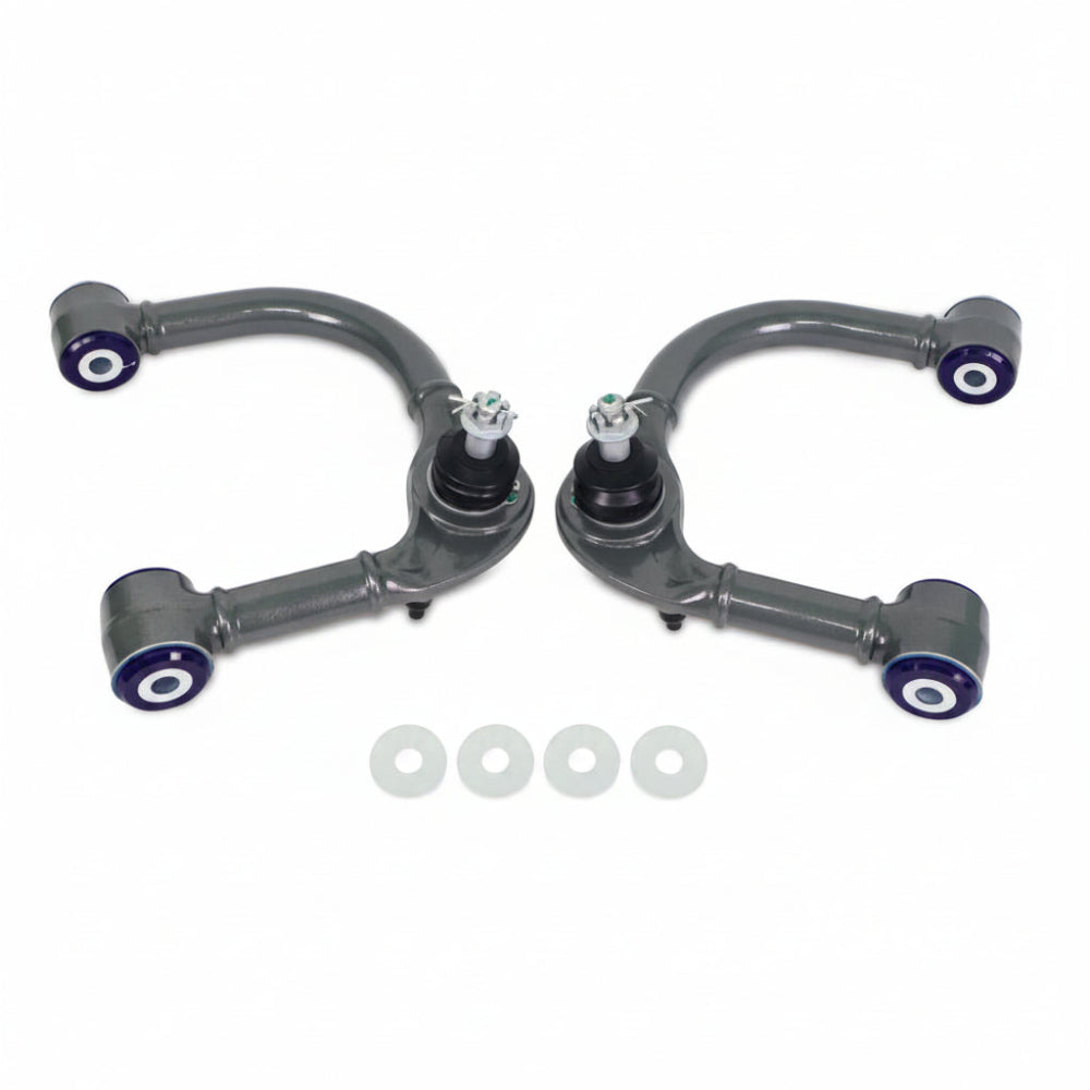 SuperPro front upper control arm pair, top-down view showing curved arm and ball joints