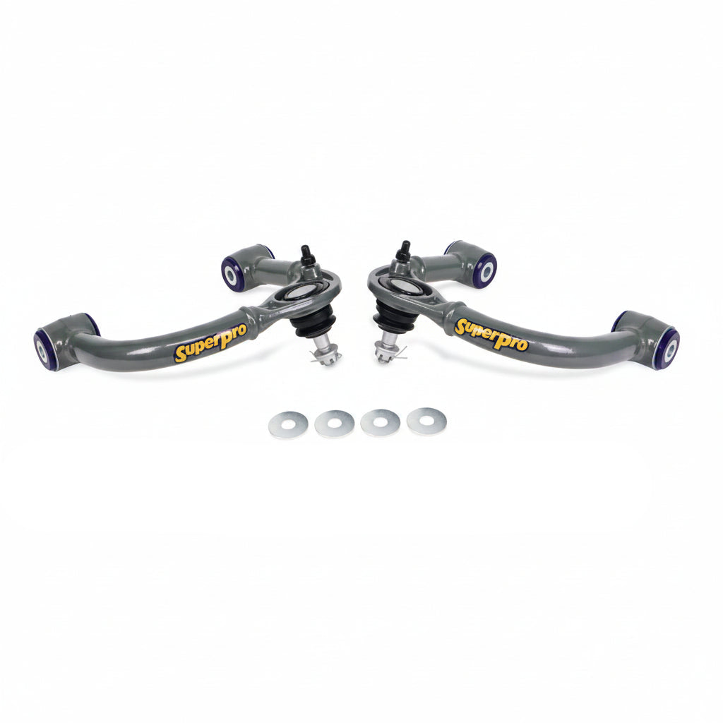 SuperPro front upper control arm pair with polyurethane bushings and hardware, angled view