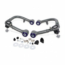 Load image into Gallery viewer, SuperPro front upper control arm pair, top-down view showing ball joint and mounting studs