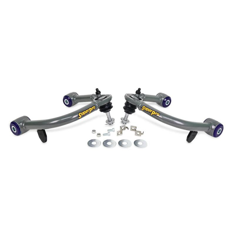 SuperPro front upper control arm pair with polyurethane bushings and hardware kit, angled view