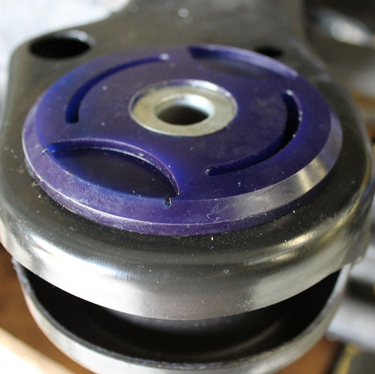 Close-up of SuperPro SPF3946K polyurethane rear subframe bushings for BMW 1M E82 showing design and material