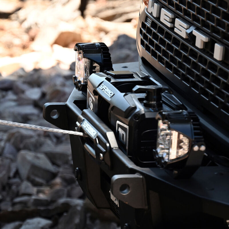 Superwinch 10000SR 12V winch shown out of package with synthetic rope and mounting hardware