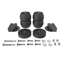 Load image into Gallery viewer, Timbren suspension enhancement kit components laid out: rubber bumpers, brackets, and mounting hardware