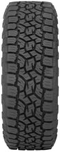 Load image into Gallery viewer, Toyo Open Country A/T III tire mounted on lifted truck wheel