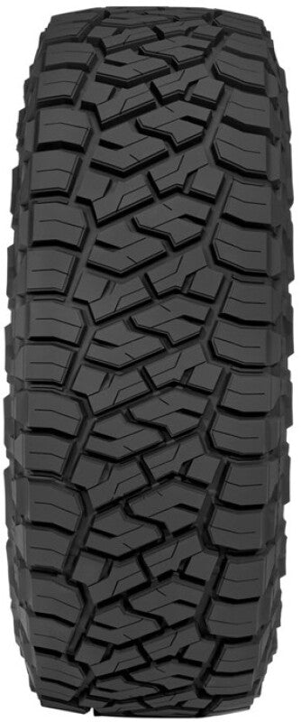Toyo R/T Trail tire demonstrating aggressive off-road traction in mud/rocks