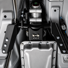 Load image into Gallery viewer, UMI 2261-B torque arm relocation kit installed under a GM F-Body