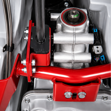 Load image into Gallery viewer, Close-up of the UMI 2261-R torque arm mount installed under the vehicle