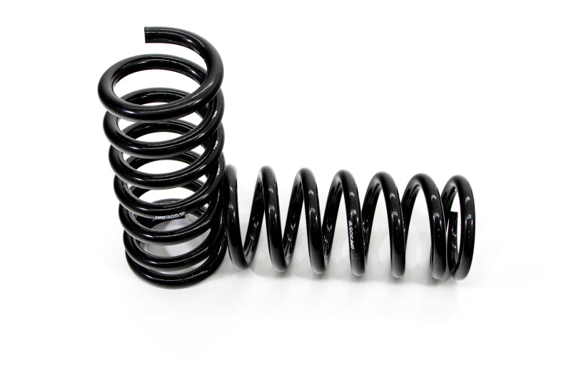 UMI 3051F pair of black powder coated 5160 chrome silicon front lowering springs with evenly pitched linear rate coils, a ground flat top end and an open pigtail bottom end, for a 2 inch drop on 1978-1988 GM G-Body.