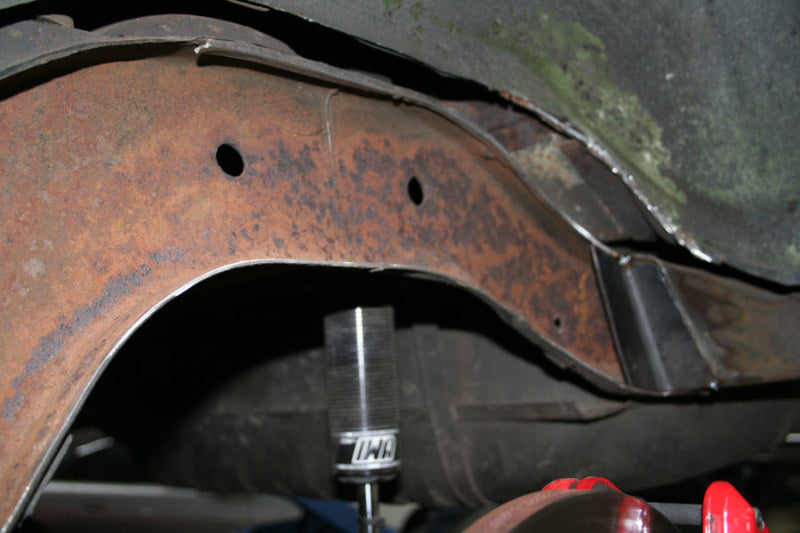 Close detail view of the bare laser cut mild steel rear frame notch plates.