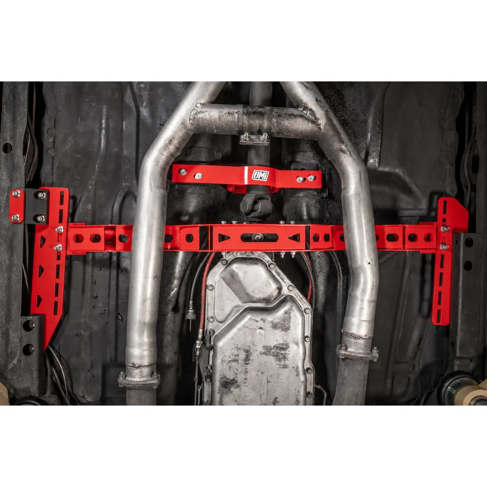 UMI Performance G-Body Transmission Crossmember installed with exhaust and transmission pan