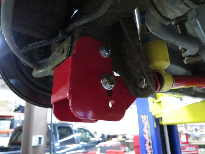 UMI Performance red bolt-in lower control arm relocation brackets for 1982-2002 GM F-body, product photo 4