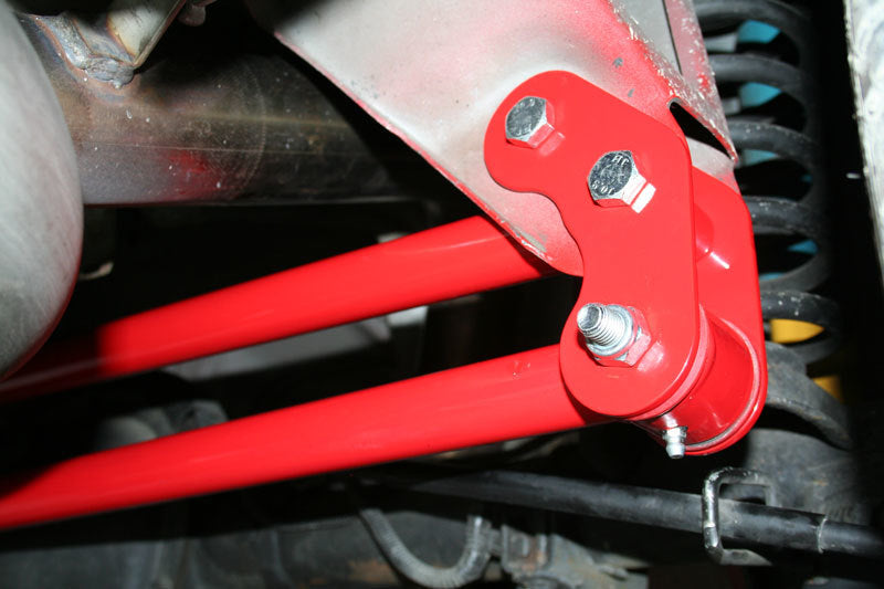 Red powder-coated upper panhard bar support tube from the UMI 82-02 F-body relocation kit