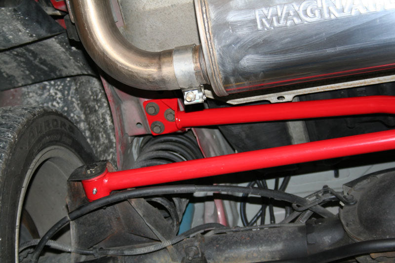 Second view of the UMI red powder-coated panhard bar relocation kit for 1982-2002 GM F-body cars