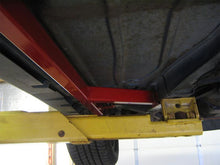 Load image into Gallery viewer, Passenger side two piece assembly of the black UMI 2400-B subframe connector set