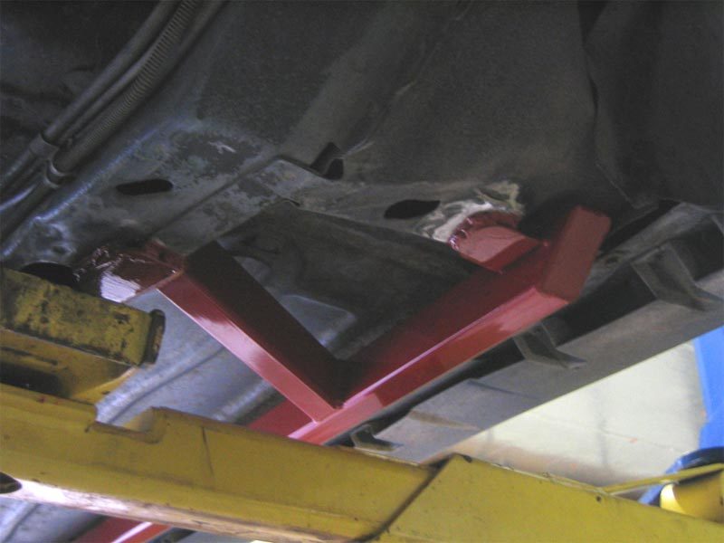 Driver side single piece black UMI 2400-B subframe connector