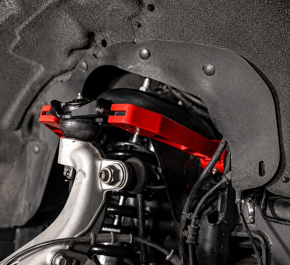 UMI Performance red upper control arms for lowered Ford F-150 trucks