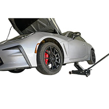 Load image into Gallery viewer, PERRIN jack pad in use on vehicle in garage