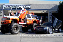 Load image into Gallery viewer, Close-up of Lambo hinge assembly by Vertical Doors Inc.