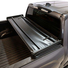 Load image into Gallery viewer, Close-up of the Westin 19-20285 tonneau cover pull-and-twist latch beneath the bed rail.