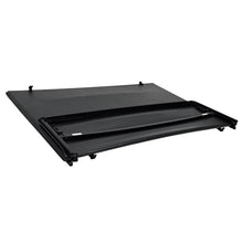 Load image into Gallery viewer, Westin 19-20285 soft tonneau cover folded into its compact three-panel position.