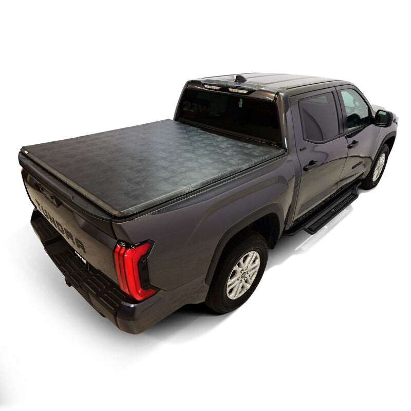 Rear view of a Toyota Tundra with the Westin 19-20285 cover partially folded.