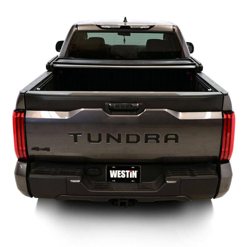 Rear view of a Toyota Tundra with the Westin 19-20285 tonneau cover fully closed.