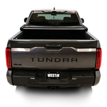 Load image into Gallery viewer, Rear view of a Toyota Tundra with the Westin 19-20285 tonneau cover fully closed.